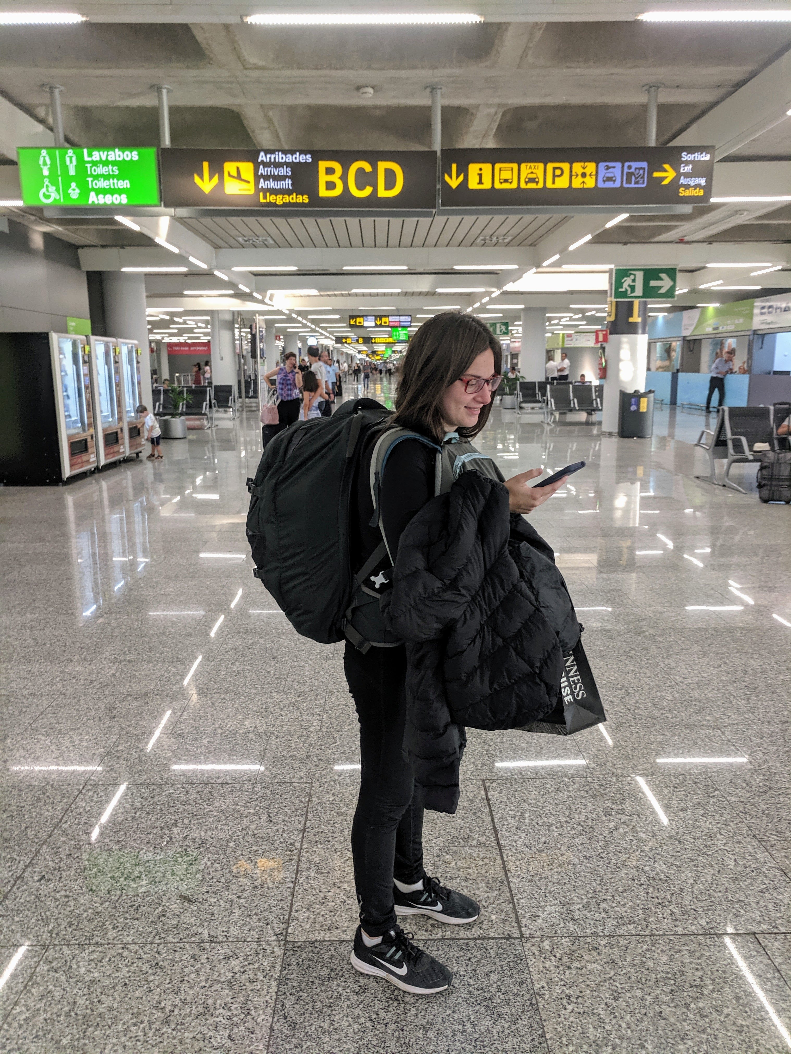At Amsterdam's airport, carrying only a medium backpack and a small one for at least 6 months of travel