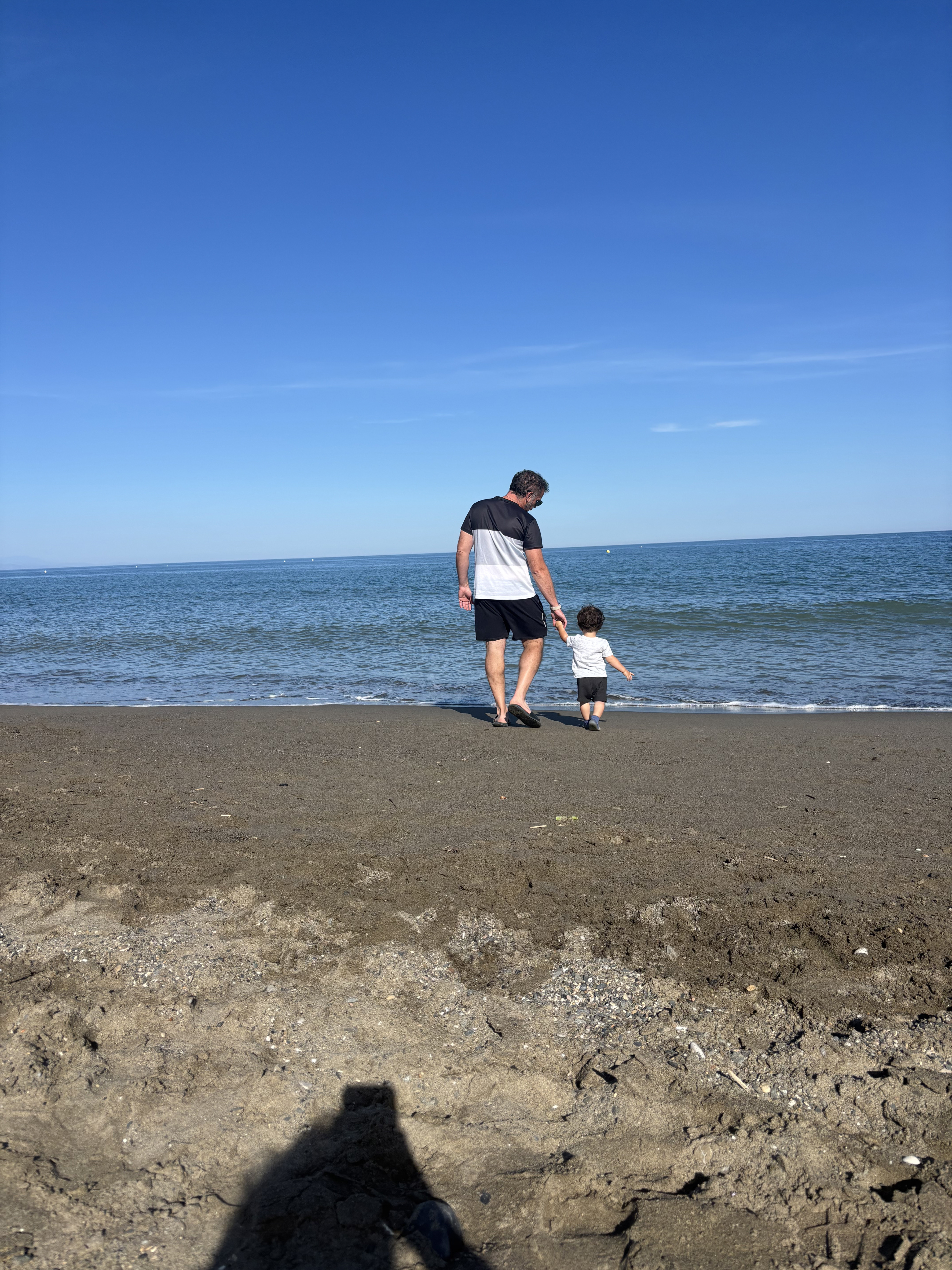 Deb with her partner Fer and baby Nico on the beach